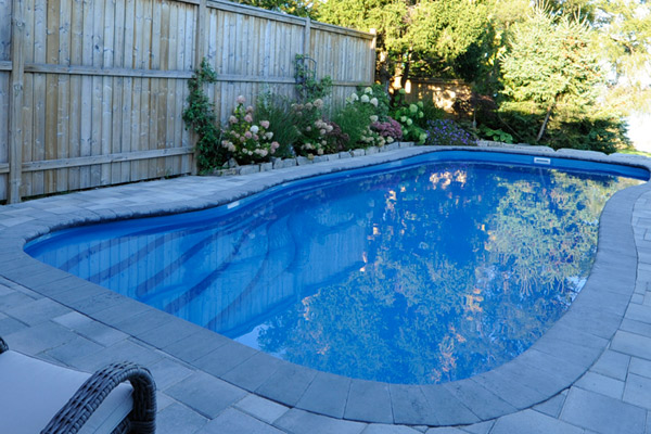 southport fiberglass pool overlooking in backyard